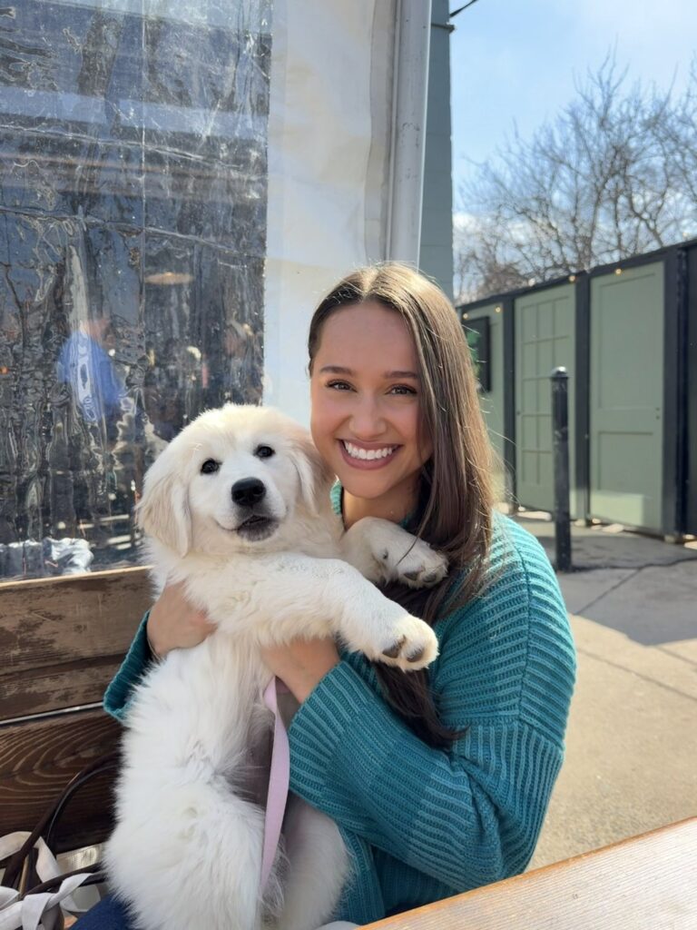 Carly holding her puppy Feta